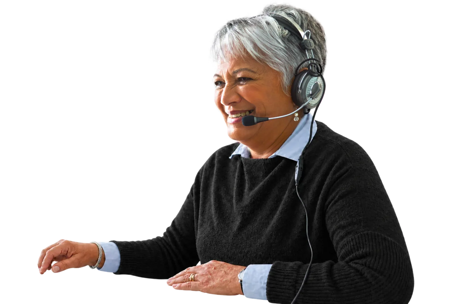 A friendly KiwiFirst team member wearing a telephone headset